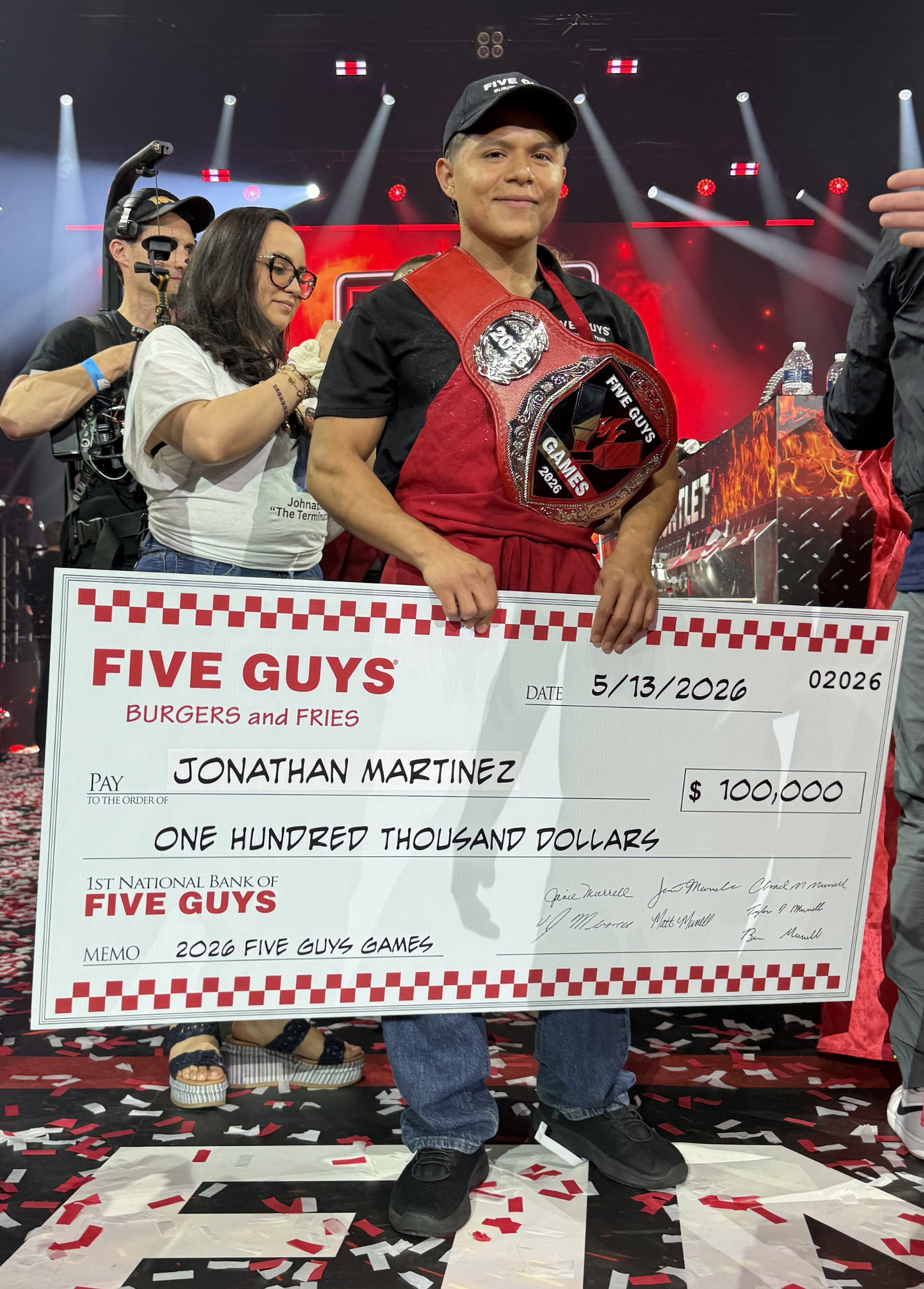 Jonathan Martinez poses with his grand prize check after winning the 2026 Five Guys Games.